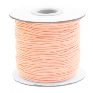 Gekleurd elastisch draad 1 mm dik. Light peach. Per meter.